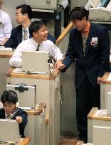 Dealers smile as Nikkei regains 15,000+